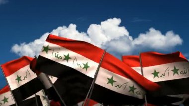 Irak bayrakları sallayarak