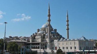 Istanbul, Turkey, August 1, 2025. The iconic view of the city: the New Mosque with a viewpoint from the Galata Bridge. Beautiful summer day. Travel destinations.