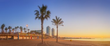 Barceloneta Beach in Barcelona at sunrise clipart