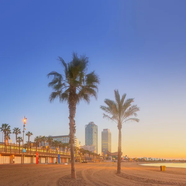 Barceloneta Beach in Barcelona at sunrise — Stock Photo, Image