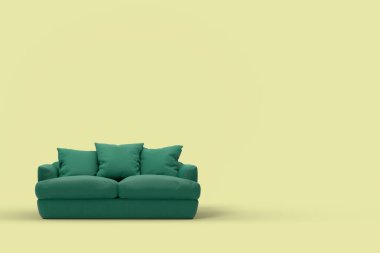 Stüdyo sarı arka planda yastıklı yeşil kanepe.