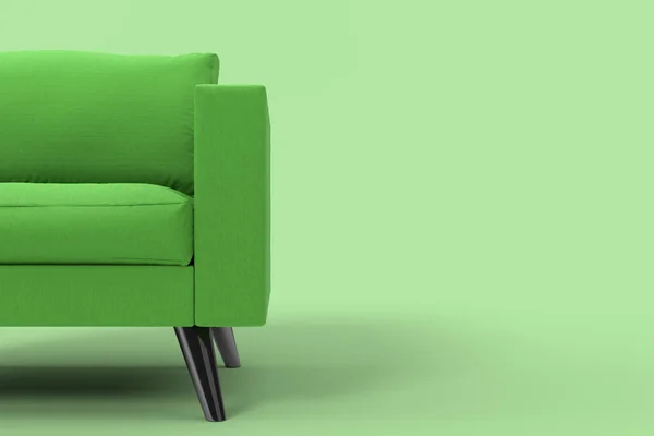 Poltrona verde com travesseiros no estúdio fundo verde. — Fotografia de Stock