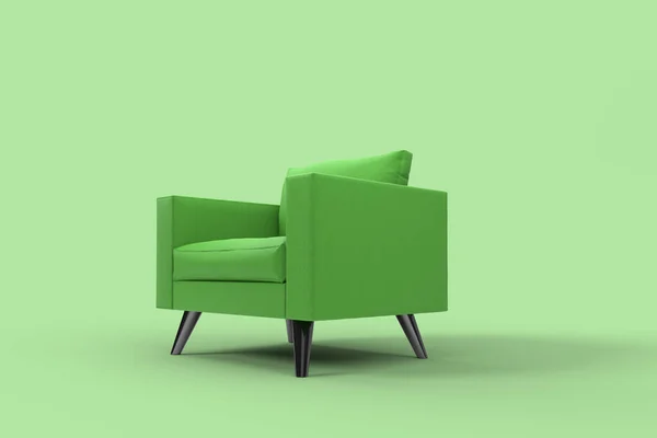 スタジオの緑の背景に枕と緑のアームチェア. — ストック写真
