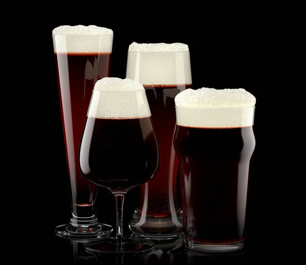 Set of fresh stout beer glasses with bubble froth isolated on black background. — Stock Photo, Image