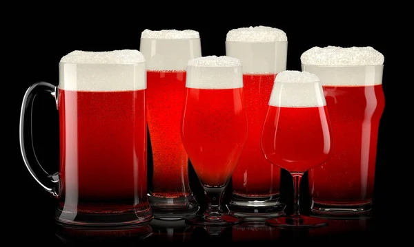Set of fresh stout beer glasses with bubble froth isolated on black background.