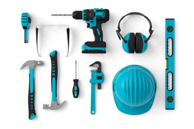 Top view of green construction tools for repair and installation on white