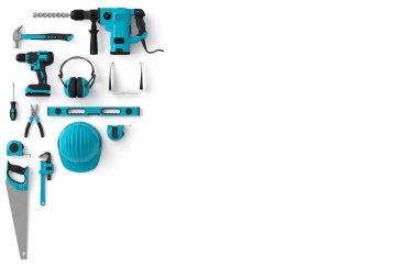 Top view of green construction tools for repair and installation on white