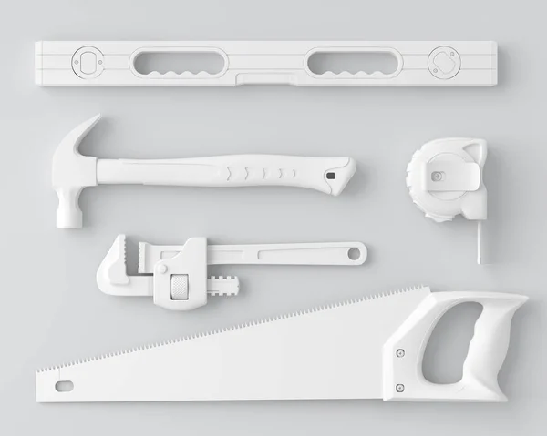 Vue de dessus des outils de construction monochromes pour la réparation et l'installation sur blanc — Photo