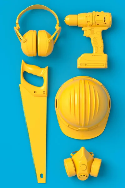 Bovenaanzicht van monochrome bouwgereedschap voor reparatie op blauw en geel — Stockfoto
