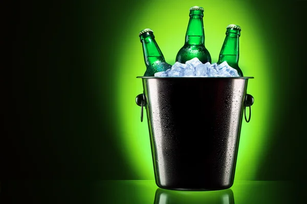 Beer bottles in ice bucket