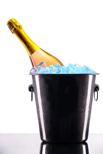 Bottle of champagne in ice bucket — Stock Photo, Image