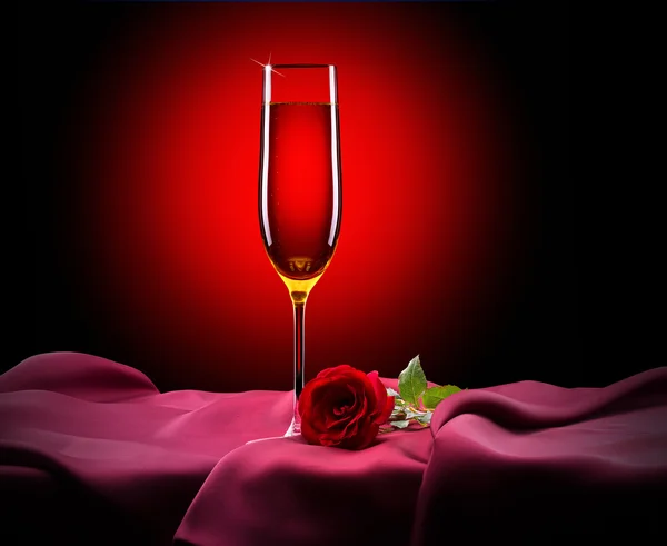 Glass of champagne and rose on black — Stock Photo, Image