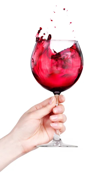 Bicchiere di vino rosso con spruzzi in mano isolato — Foto Stock