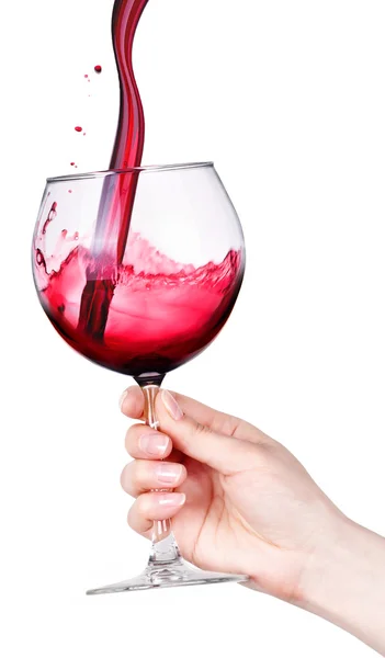 Glass of red wine with splashes in hand isolated — Stock Photo, Image