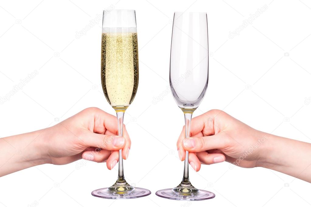 Hand with glasses of champagne isolated on a white