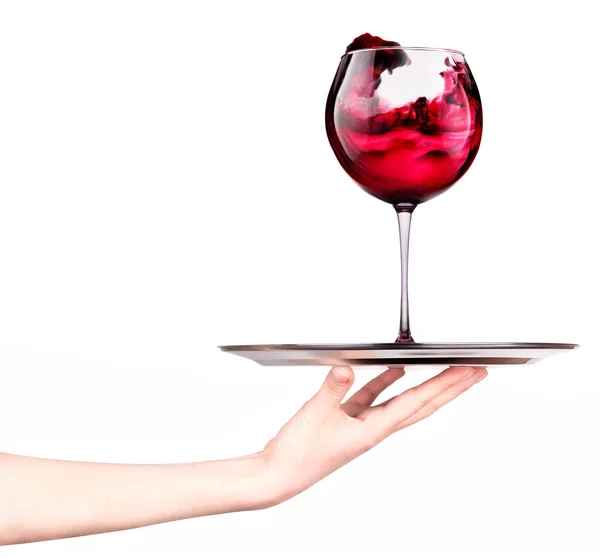 Waitresses holding tray with glass of red wine — Stock Photo, Image