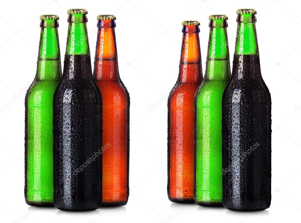 Set of beers bottles with frosty drops isolated