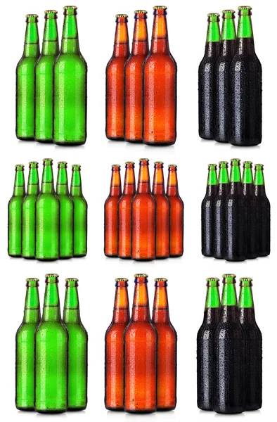 Набор бутылок пива с морозными капельками изолирован — стоковое фото