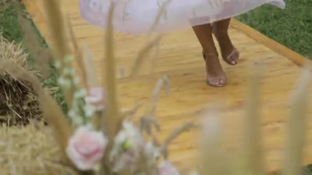 Young bride circling in park slowmotion — Stock Video