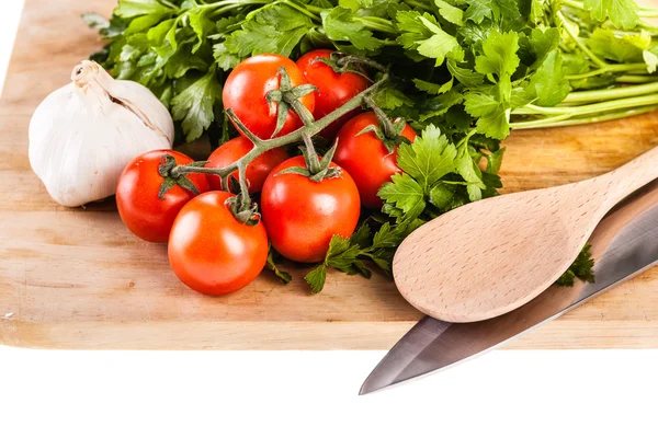 Śródziemnomorskiej pietruszka pomidory czosnek i łyżkę — Zdjęcie stockowe