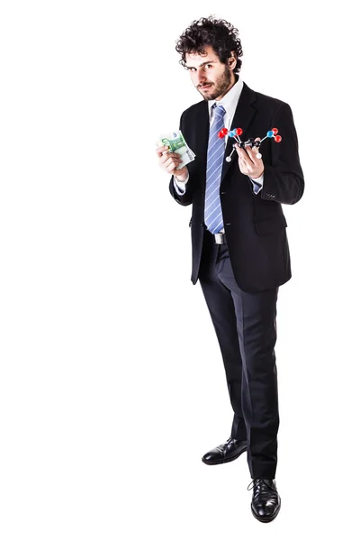 Businessman with a tnt molecule and money — Stock Photo, Image