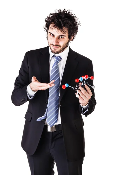 Businessman holding a tnt molecule — Stock Photo, Image