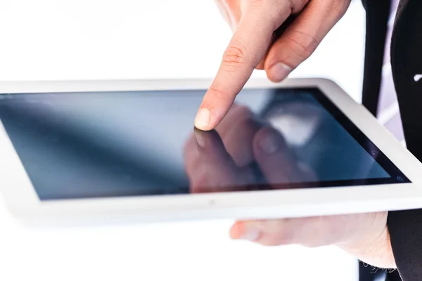 Businessman using touchscreen on a tablet — Stock Photo, Image