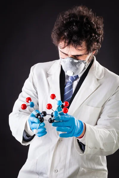 Researcher with a tnt molecule — Stock Photo, Image