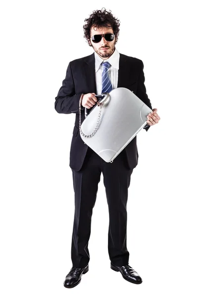 Businessman with sunglasses and handcuffed suitcase — Stock Photo, Image