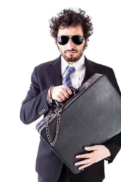 Cool businessman with chained suitcase — Stock Photo, Image