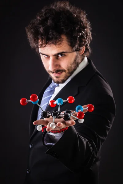 Hombre de negocios holding tnt molecular structure —  Fotos de Stock