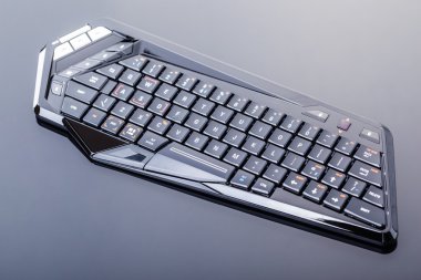 Futuristic gaming keyboard on black clipart