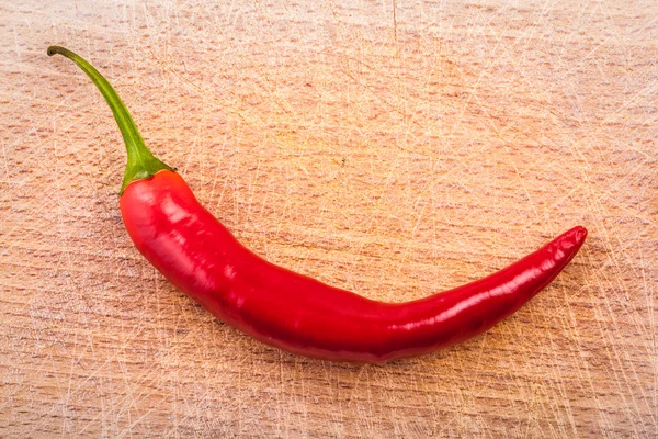 Chili pepper on wood — Stock Photo, Image