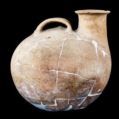 Ancient Daunian askos over black