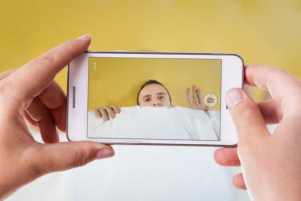 Shy man phone photography — Stock Photo, Image