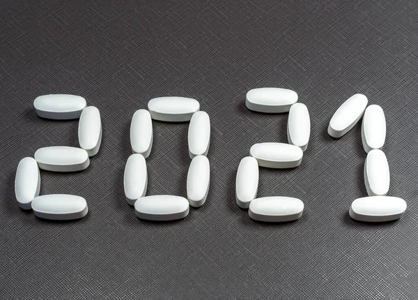 A lettering 2021 created by pills on the dark background.