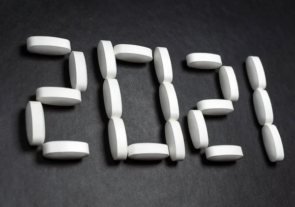 A lettering 2021 created by pills on the dark background.