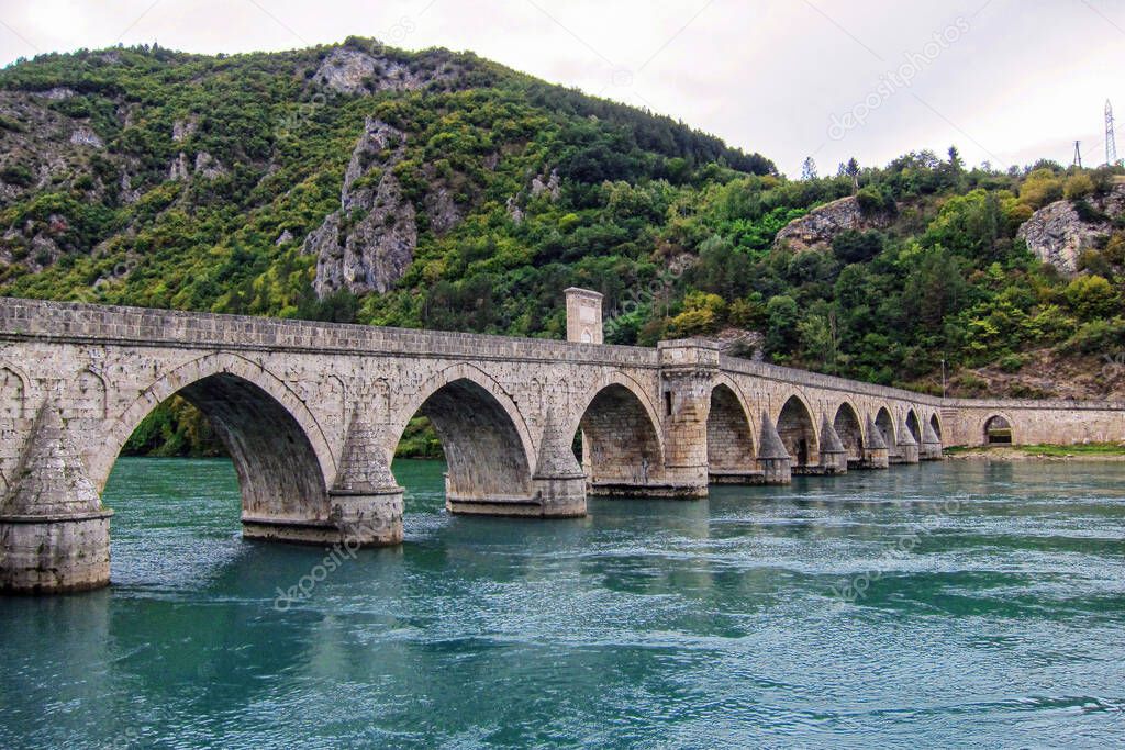 Beautiful green Drina. Mehmed Pasa Sokolovic Bridge. Literary and historical cultural landmark of the Balkan Peninsula.