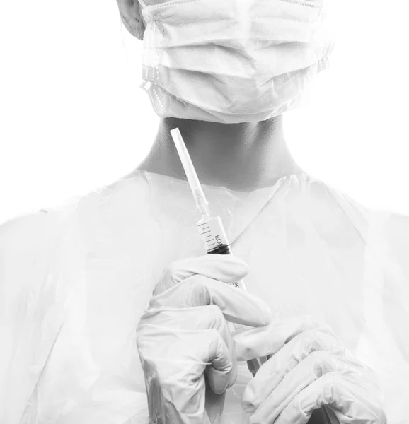 Syringe in doctor hands
