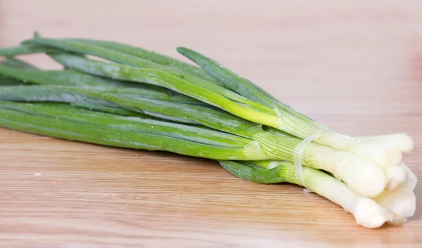 Leek on a wooden surface — Stock Photo, Image