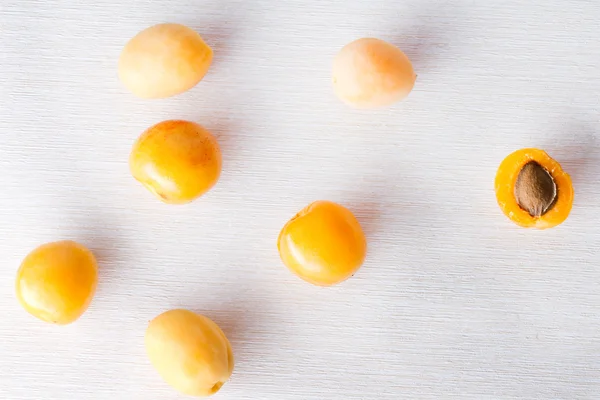 Apricots on a white surface — Stock Photo, Image