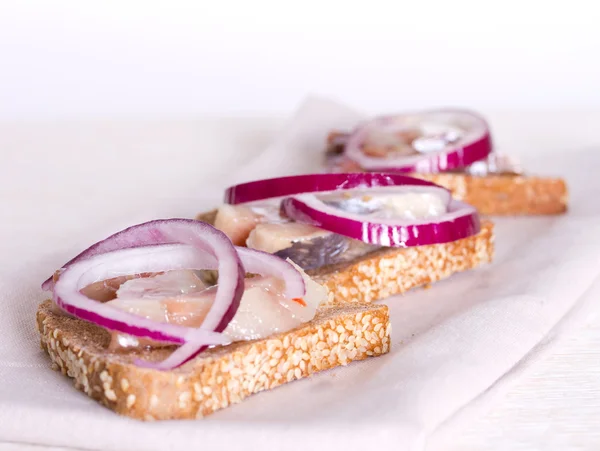 Fisherman Sandwich with rye bread, herring and red onion — Stock Photo, Image