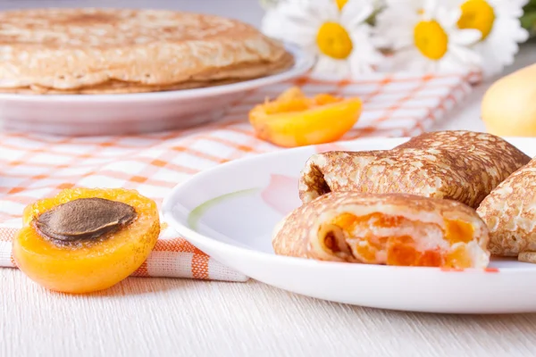 Pancakes with curd cheese and dried apricots — Stock Photo, Image