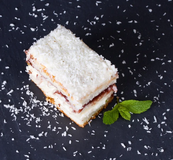 Cake with sprinkles of coconut — Stock Photo, Image