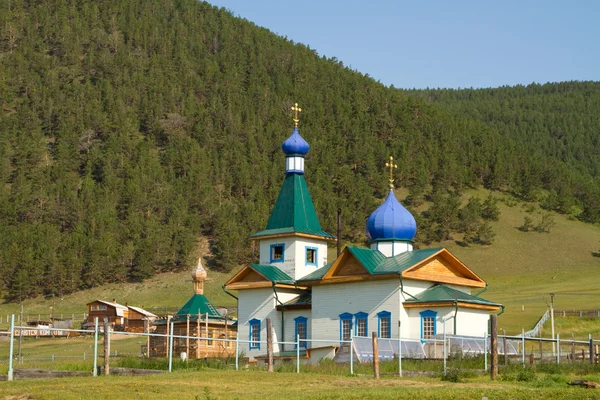 Small wooden church in the Grand Goloustnoe — Stock Photo, Image