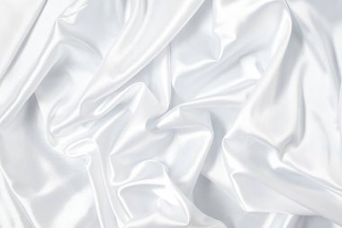 Beyaz saten, ipek ve pamuk hazineleri. Soyut beyaz kumaş dokusu arkaplanı. Kumaş yumuşak dalga. 
