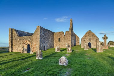 Clonmacnoise abbey is situated in County Offaly, Ireland on the River Shannon south of Athlone clipart