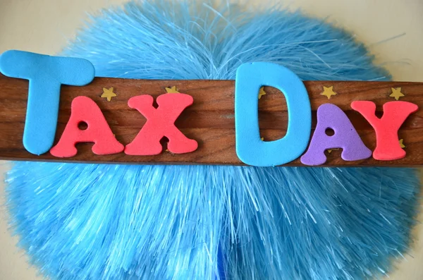 Word tax day on abstract — Stock Photo, Image