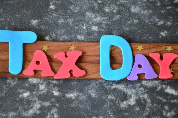 Word tax day on abstract — Stock Photo, Image