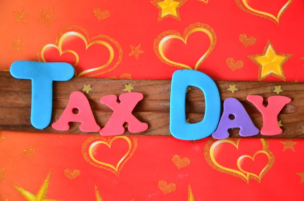 Word tax day on abstract — Stock Photo, Image